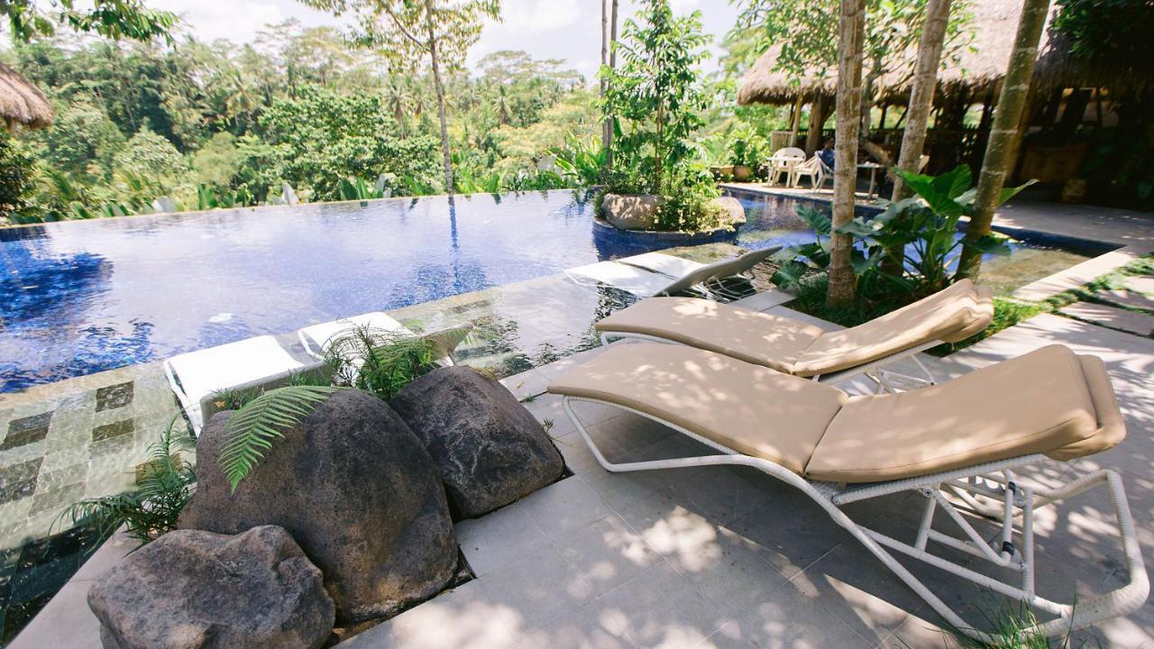 Tejaprana Resort & Spa Убуд Екстериор снимка The pool at the resort